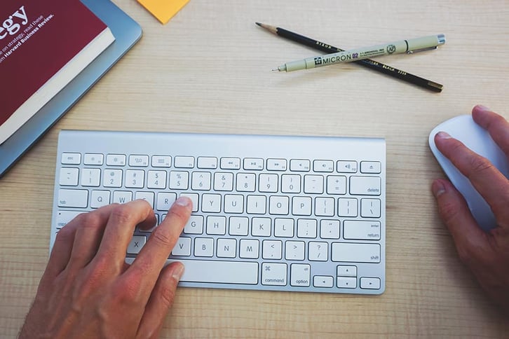 office desk with hands typing