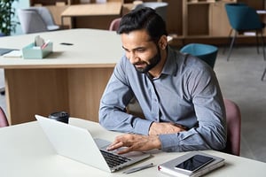 business-man-non-native-writing-on-computer