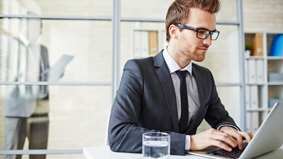 businessman-improving-writing-skills-in-online-course-from-desk