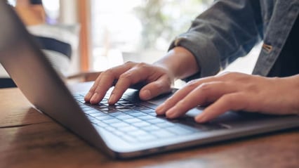 closeup-woman-writing-business-at-work