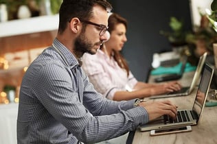 improve-business-writing-team-working-on-laptops