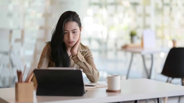 non native business writer on laptop