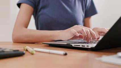 woman-type-technical-documentation-computer-at-home