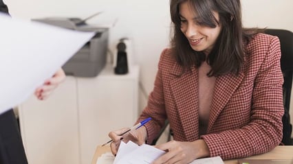 woman-writing-technical-document-at-work