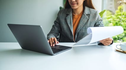 proposal-writing-working-on-laptop-computer